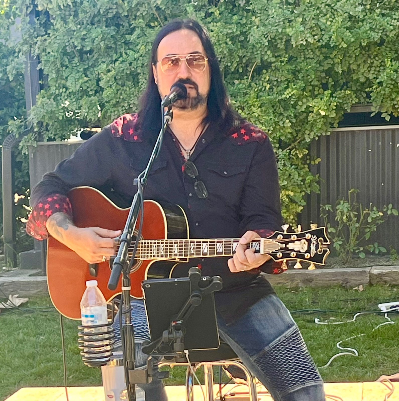 Adrian Galysh performing acoustic guitar and vocals live.