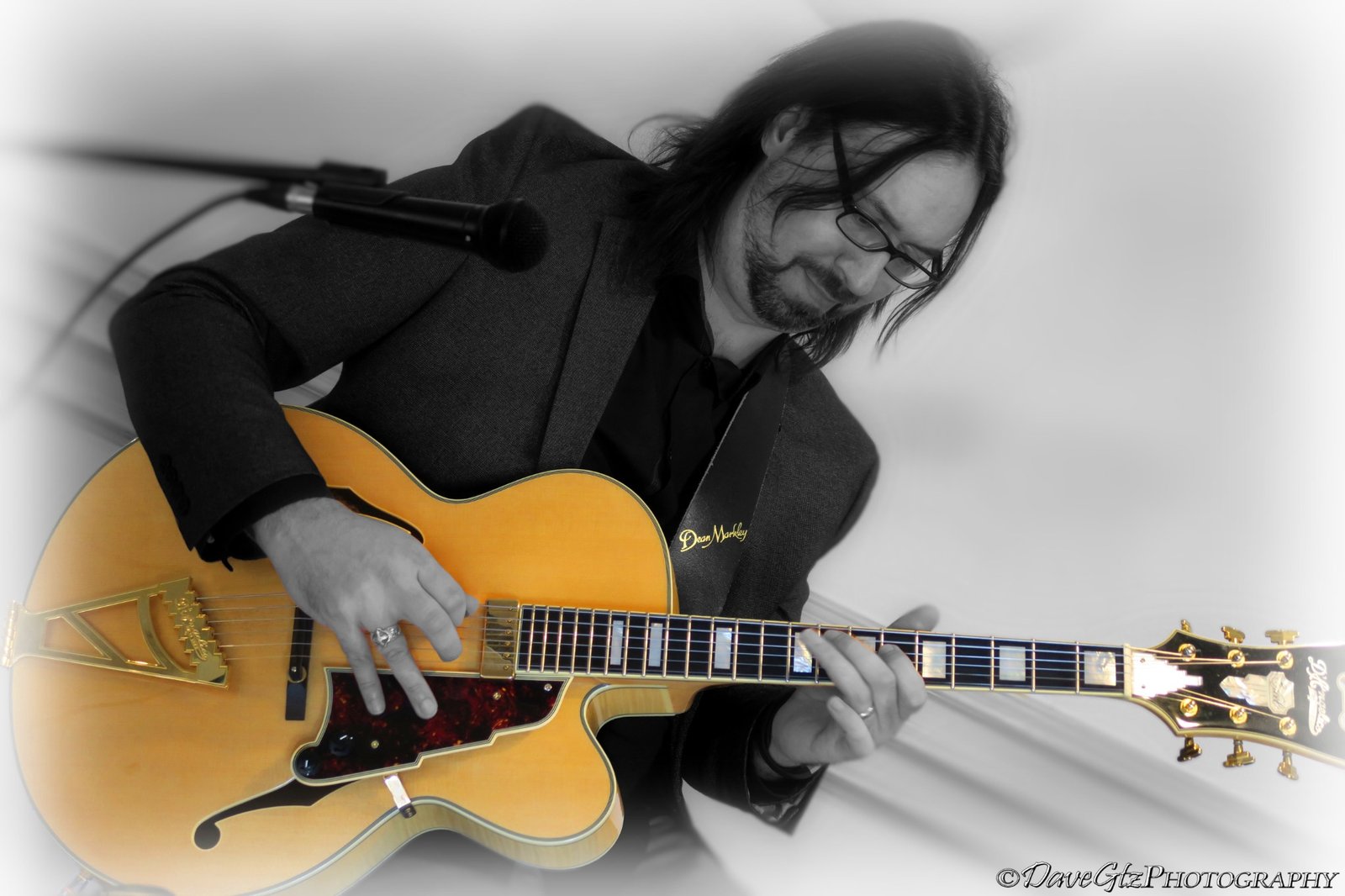 Adrian Galysh performing jazz guitar.